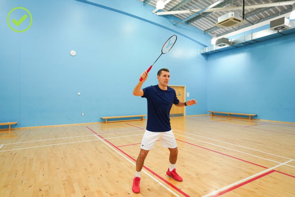 arm racket positioning at the net in badminton