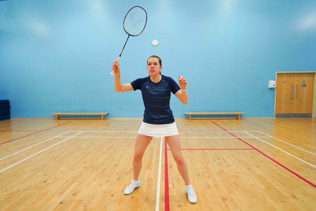 racket positioning at the net in badminton