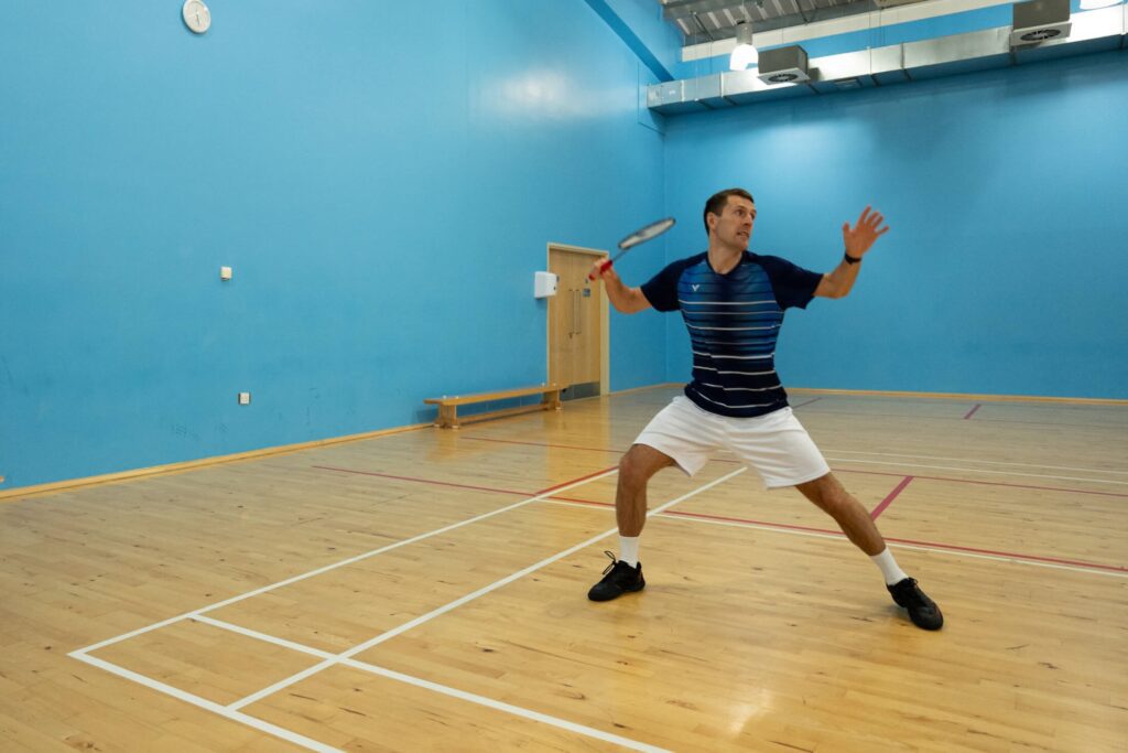 preparation for forehand scissor kick movement in badminton