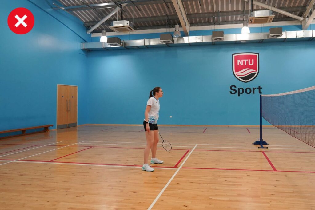 racket down at the net in badminton
