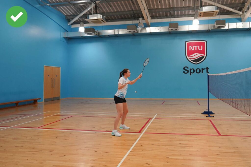 racket up at the net in badminton