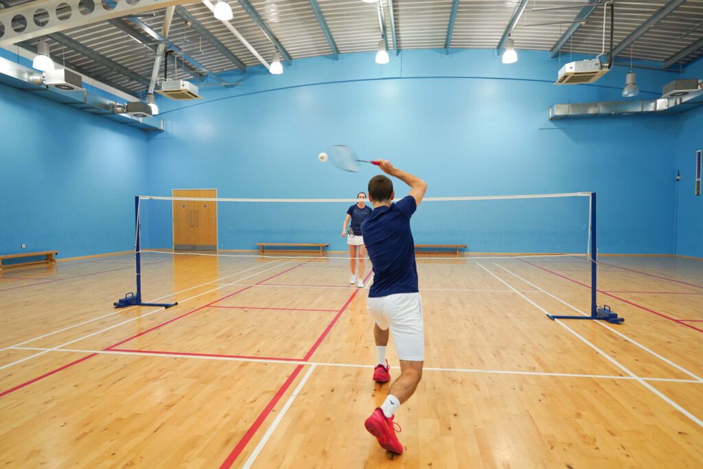 returning the flat drive serve in badminton