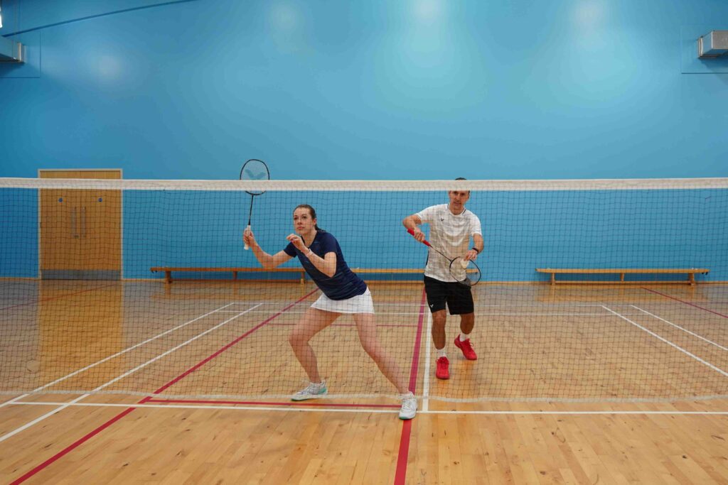 mixed doubles serve setup in badminton
